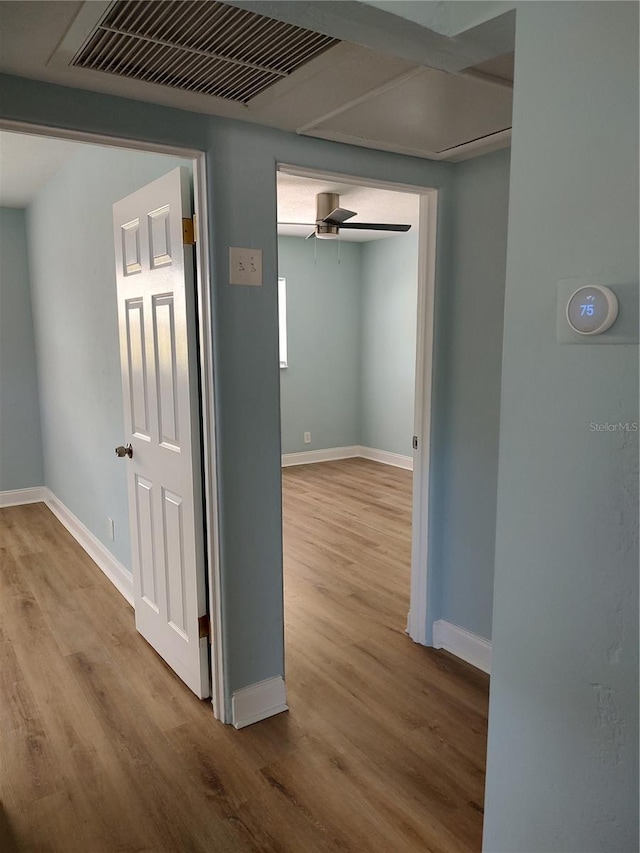 hall with light wood-type flooring