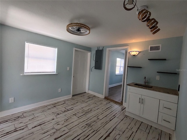 interior space featuring vanity and electric panel