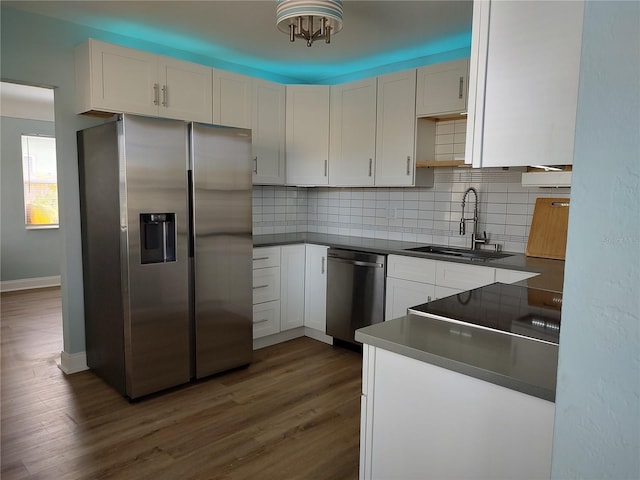 kitchen with sink, white cabinets, and appliances with stainless steel finishes