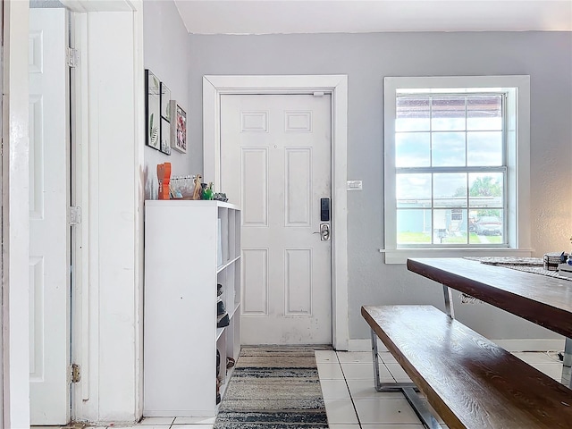 entryway with light tile patterned floors