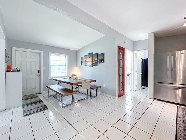 dining area featuring light tile patterned flooring