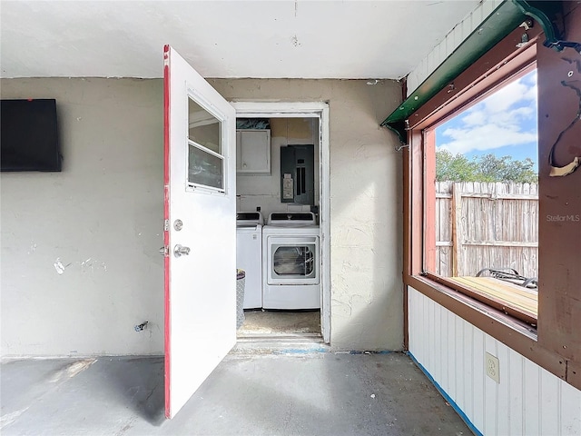 doorway to property featuring independent washer and dryer and electric panel