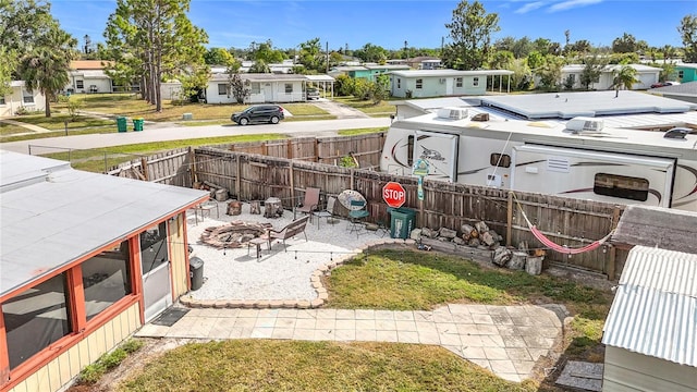 view of yard with a fire pit