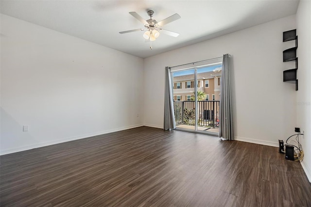 unfurnished room featuring ceiling fan and dark wood-type flooring