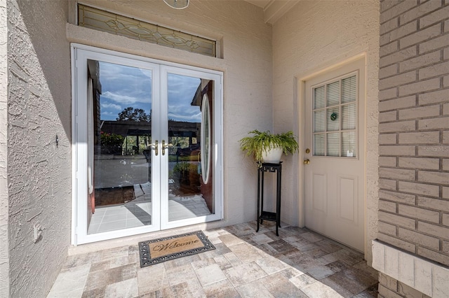 entrance to property featuring french doors