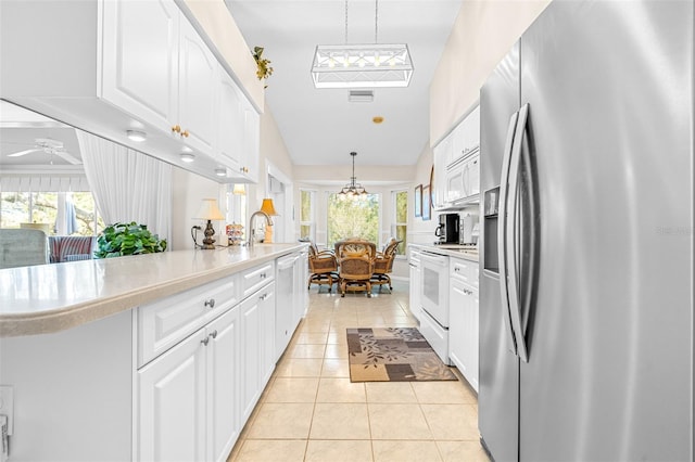 kitchen featuring decorative light fixtures, white cabinetry, white appliances, and ceiling fan