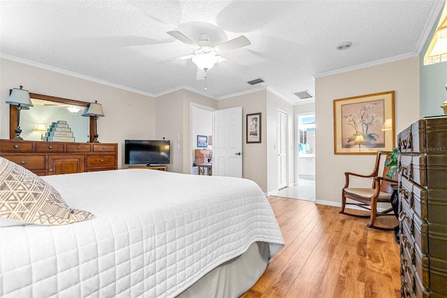 bedroom with a textured ceiling, ceiling fan, crown molding, and light hardwood / wood-style flooring