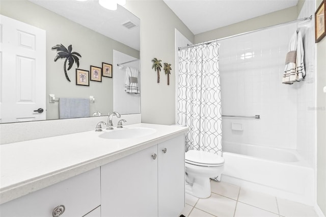 full bathroom with tile patterned flooring, shower / tub combo, vanity, and toilet