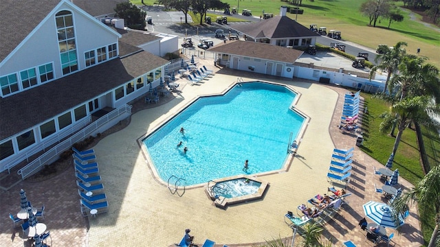 view of swimming pool featuring a patio area