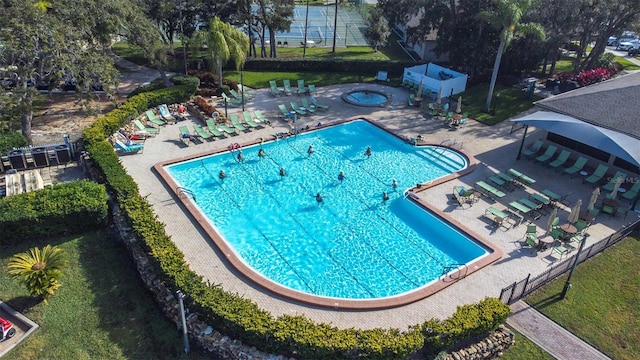 view of swimming pool with a yard and a patio