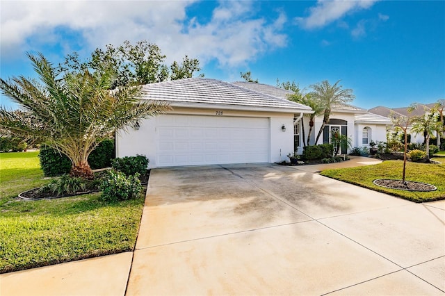 single story home with a front yard and a garage