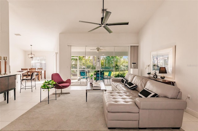 living room featuring ceiling fan and light tile patterned floors