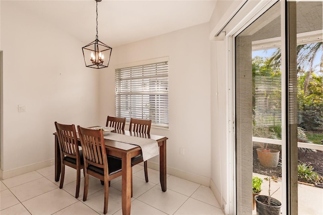 dining room featuring a chandelier, plenty of natural light, and light tile patterned flooring