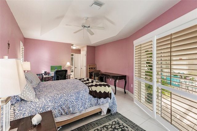 tiled bedroom with ceiling fan