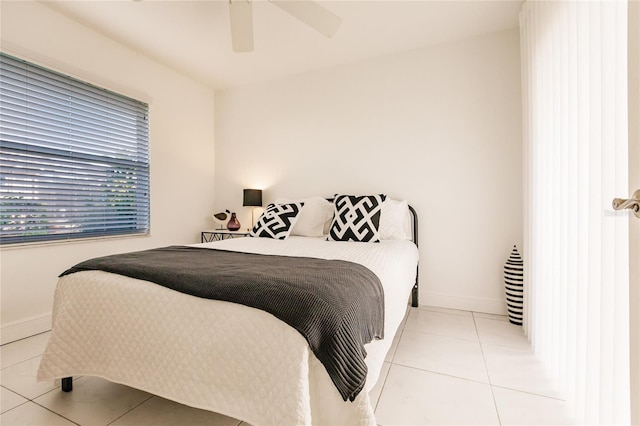 bedroom featuring ceiling fan and light tile patterned floors