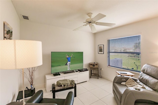 living room with ceiling fan and light tile patterned flooring