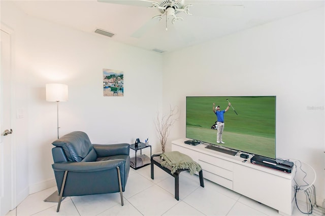 living area featuring ceiling fan and light tile patterned floors