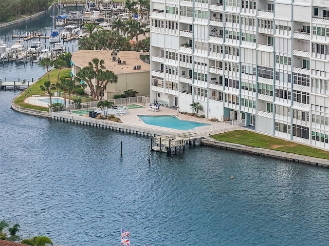 view of swimming pool featuring a water view