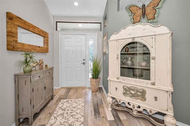 1012 Osprey Ct, Tarpon Springs, FL 34689 - entrance foyer with light wood-style floors and recessed lighting