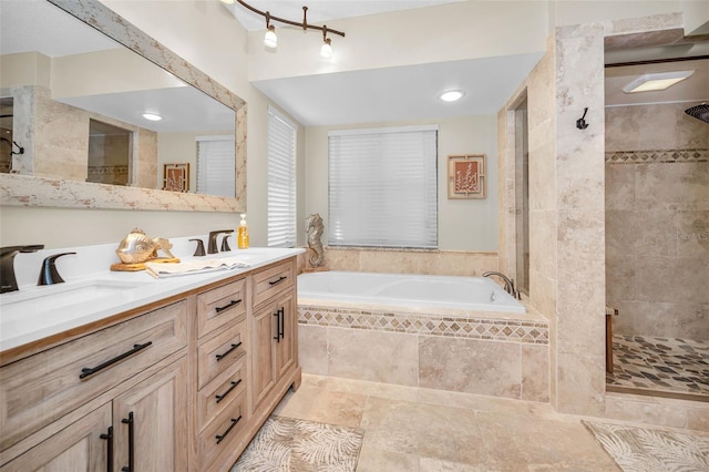 1012 Osprey Ct, Tarpon Springs, FL 34689 - full bath with a garden tub, double vanity, and a tile shower