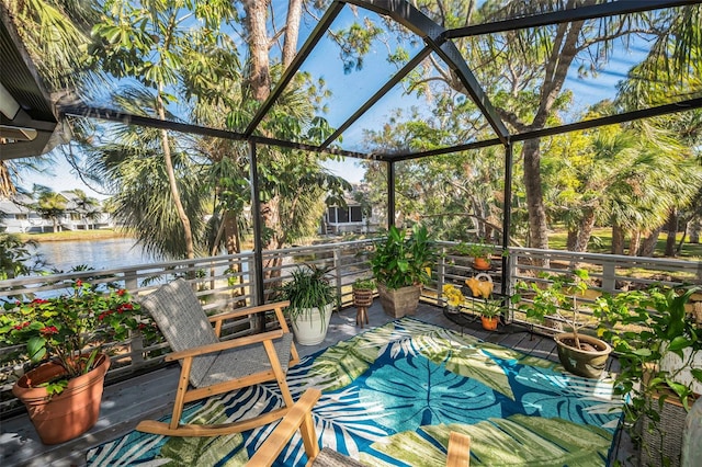 unfurnished sunroom featuring a water view