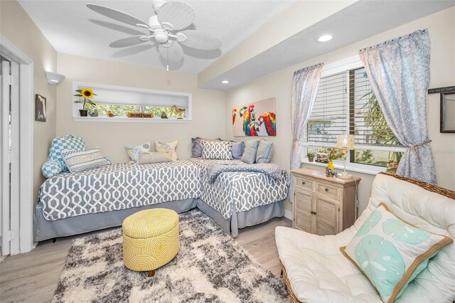 1012 Osprey Ct, Tarpon Springs, FL 34689 - bedroom with wood finished floors, multiple windows, recessed lighting, and ceiling fan