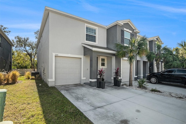 3345 Pleasant Willow Ct, Brandon, FL 33511 - view of front of home featuring stucco siding, a garage, driveway, and a front yard