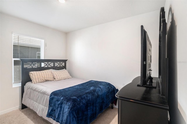 bedroom with light carpet