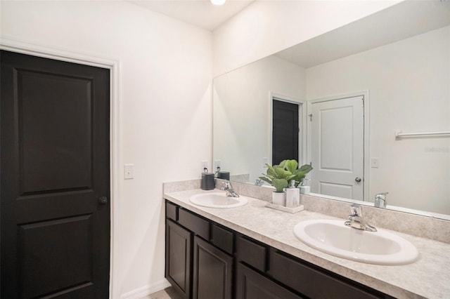 3345 Pleasant Willow Ct, Brandon, FL 33511 - bathroom featuring double vanity and baseboards