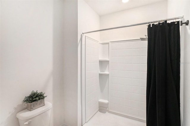 bathroom with walk in shower and toilet