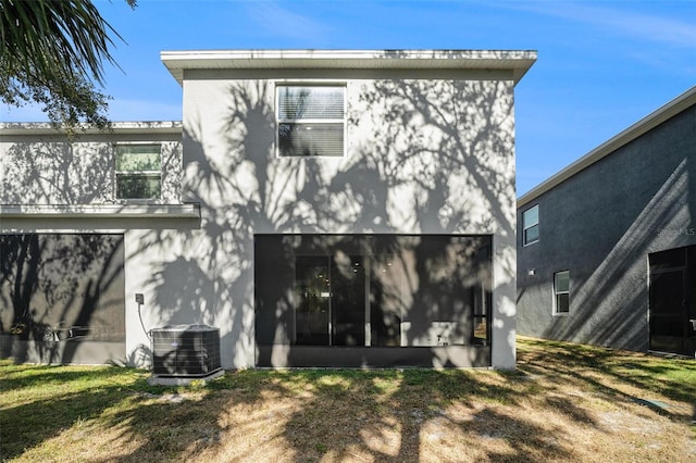 3345 Pleasant Willow Ct, Brandon, FL 33511 - rear view of property with stucco siding and a sunroom