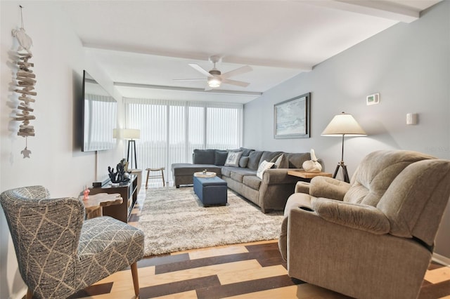 living room featuring hardwood / wood-style flooring, ceiling fan, and beam ceiling