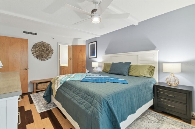 bedroom with ceiling fan and hardwood / wood-style floors