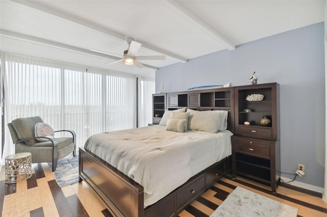 bedroom featuring beam ceiling, ceiling fan, and light hardwood / wood-style floors