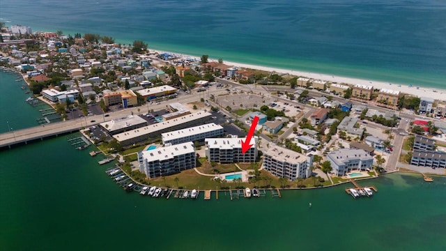 aerial view with a water view and a view of the beach