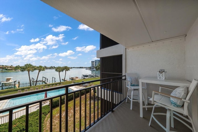 balcony featuring a water view