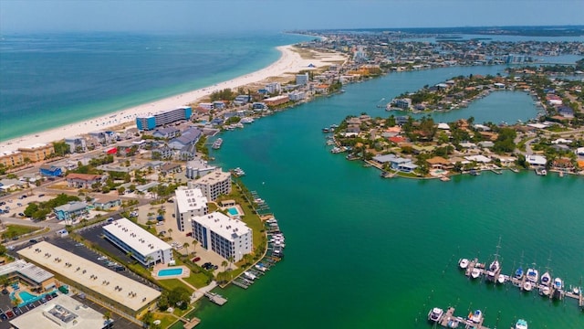 birds eye view of property with a beach view and a water view