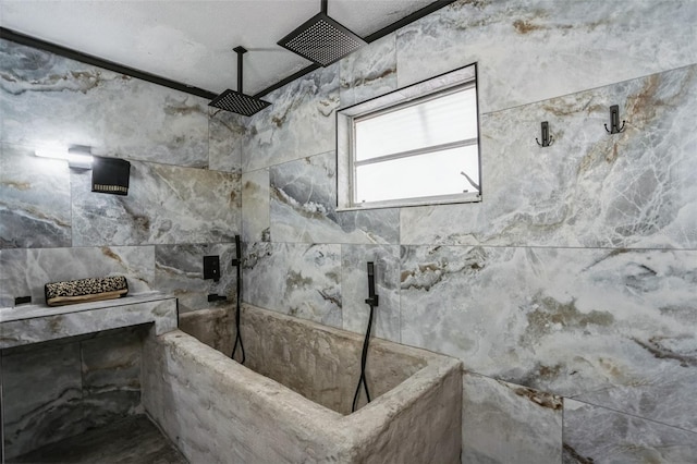 bathroom featuring a tile shower