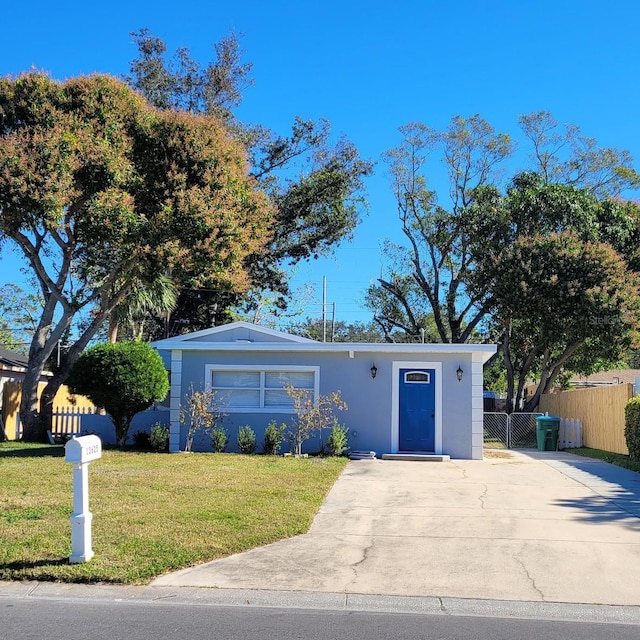 ranch-style house with a front yard