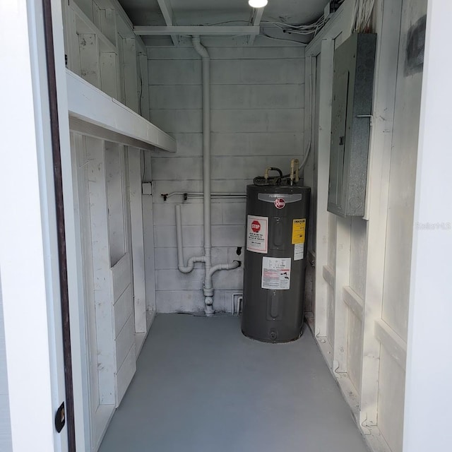 utility room with electric water heater and electric panel