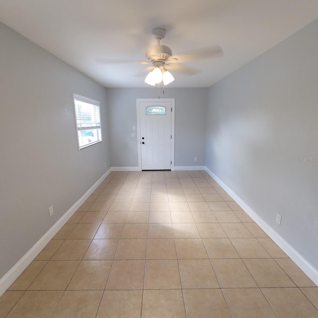 tiled entrance foyer with ceiling fan