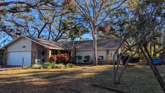 single story home with a front lawn and a garage