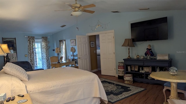 bedroom featuring ceiling fan, dark hardwood / wood-style floors, and lofted ceiling