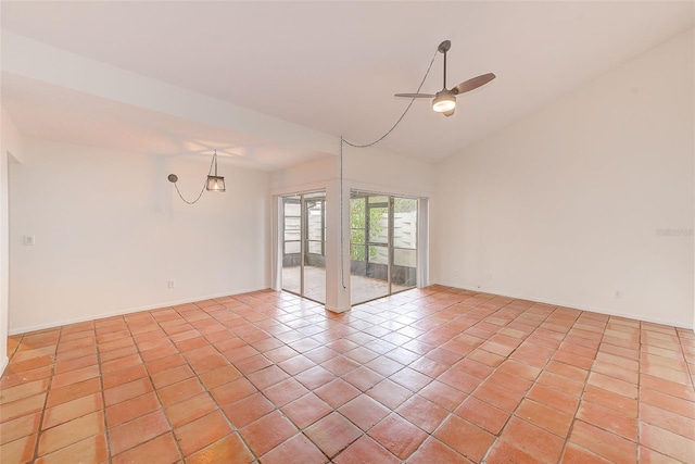 spare room with ceiling fan, light tile patterned flooring, and lofted ceiling