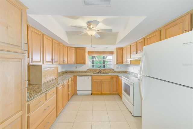 kitchen featuring light tile patterned floors, white appliances, lofted ceiling, and sink