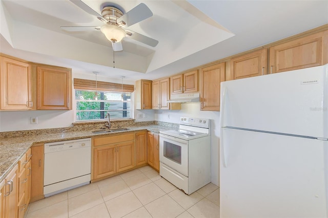 kitchen with white appliances, a tray ceiling, ceiling fan, sink, and light tile patterned flooring