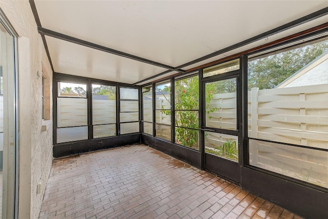 unfurnished sunroom with plenty of natural light