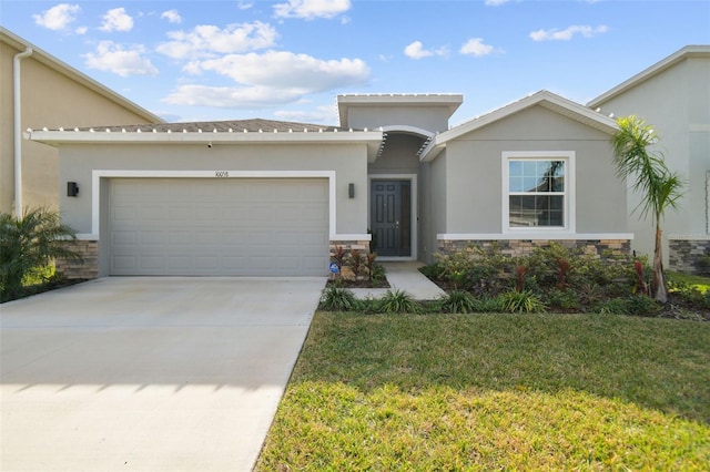 view of front facade with a front yard and a garage