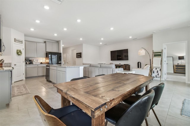 tiled dining area with sink