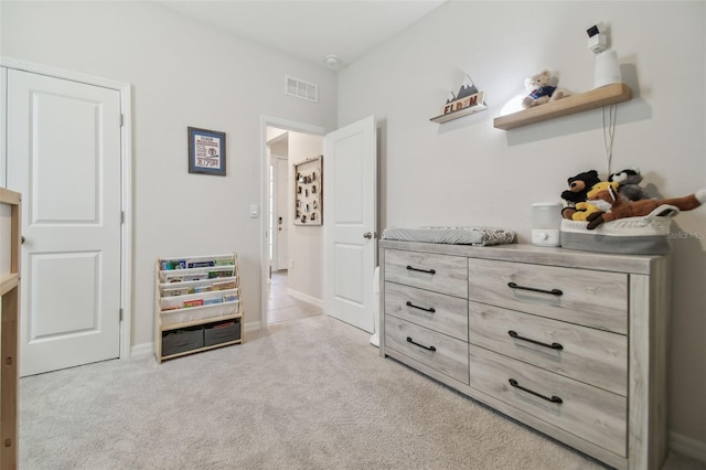 bedroom with light colored carpet